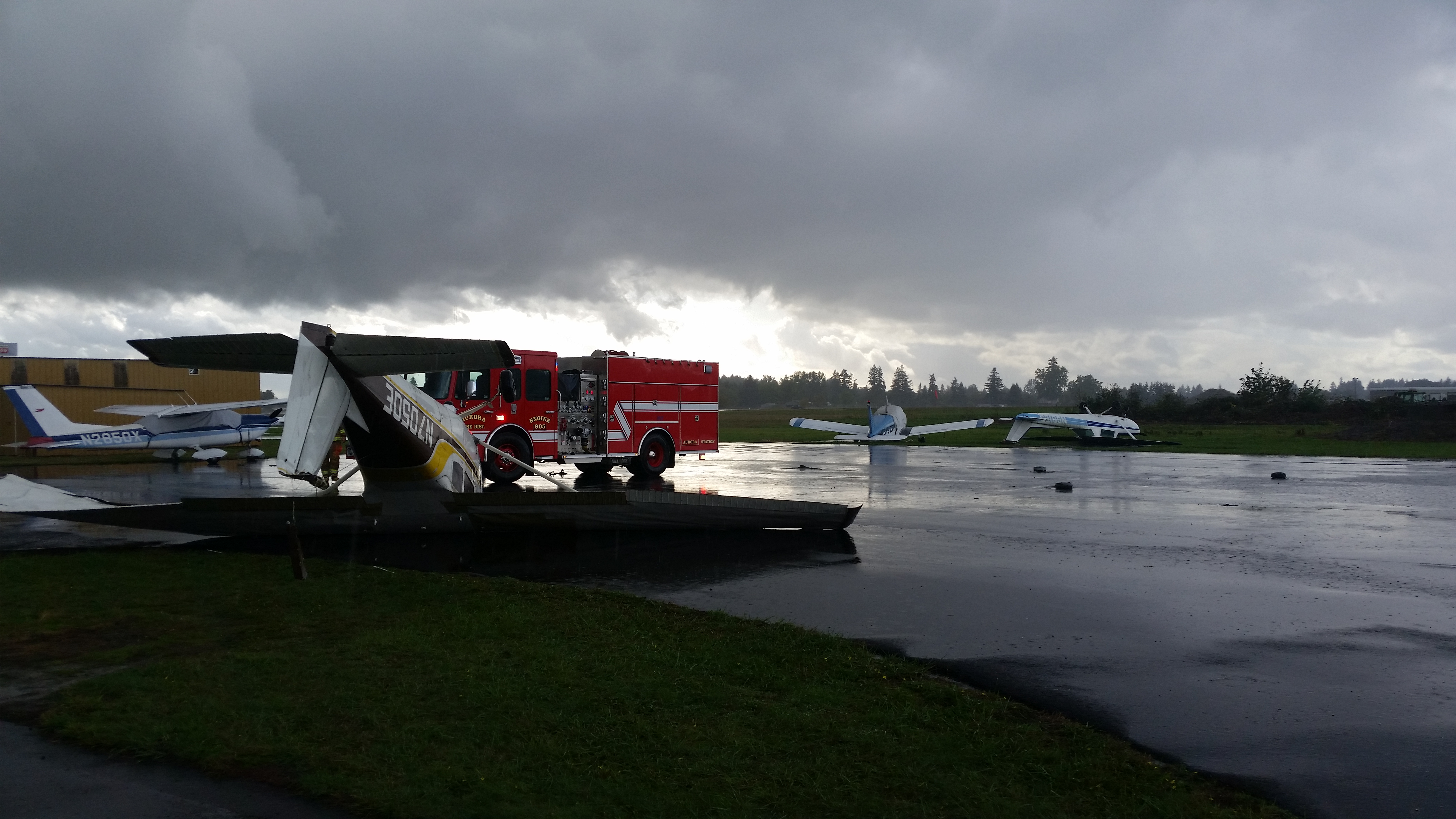 Photos Tornado flips planes at Aurora airport